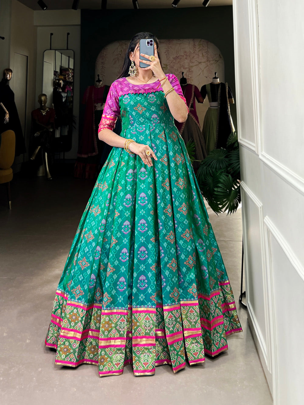 Bottle Green Color Jacquard Silk Patola Print With Zari Weaving Work Gown